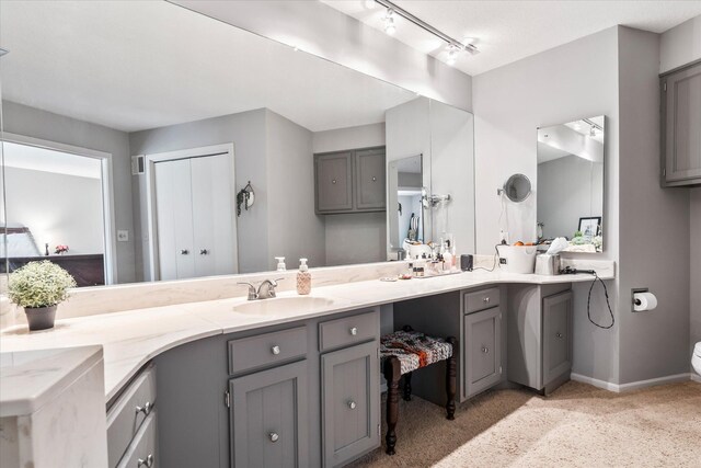 1206 Pinecrest Ln, New Richmond, WI 54017 - full bath featuring double vanity, baseboards, and toilet