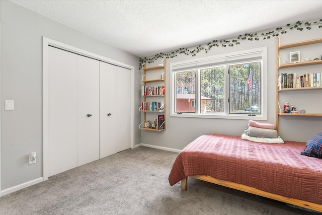 1206 Pinecrest Ln, New Richmond, WI 54017 - carpeted bedroom with a closet, a textured ceiling, and baseboards