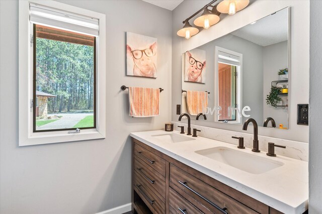 1206 Pinecrest Ln, New Richmond, WI 54017 - bathroom featuring double vanity and baseboards