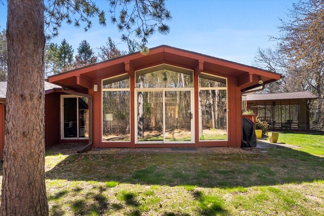 1206 Pinecrest Ln, New Richmond, WI 54017 - back of house featuring a lawn