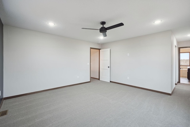 carpeted empty room featuring a ceiling fan, recessed lighting, and baseboards