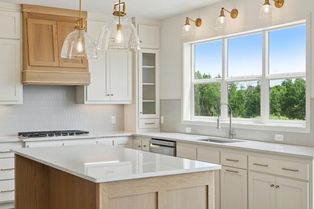 21959 Edison Ct NW, East Bethel, MN 55011 - kitchen featuring stainless steel appliances, decorative backsplash, healthy amount of natural light, and a kitchen island