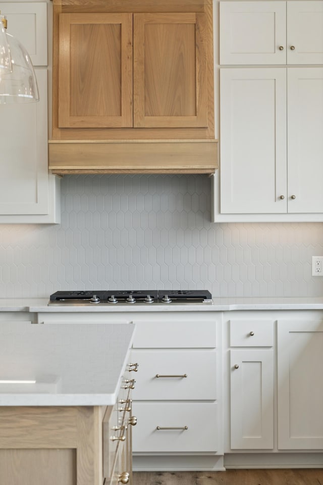 21959 Edison Ct NW, East Bethel, MN 55011 - kitchen featuring light countertops, decorative backsplash, and gas cooktop