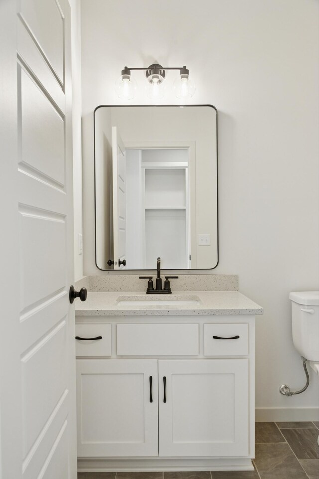 21959 Edison Ct NW, East Bethel, MN 55011 - bathroom with vanity and baseboards