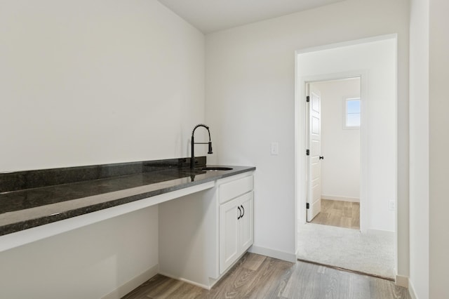 21959 Edison Ct NW, East Bethel, MN 55011 - laundry room with a sink and light wood-style flooring