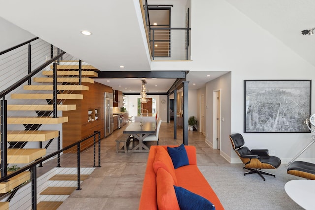 176 Peninsula Rd, Medicine Lake, MN 55441 - stairs with recessed lighting, baseboards, and a towering ceiling