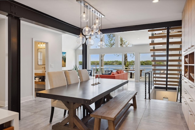 176 Peninsula Rd, Medicine Lake, MN 55441 - dining space featuring recessed lighting, a water view, baseboards, and a chandelier