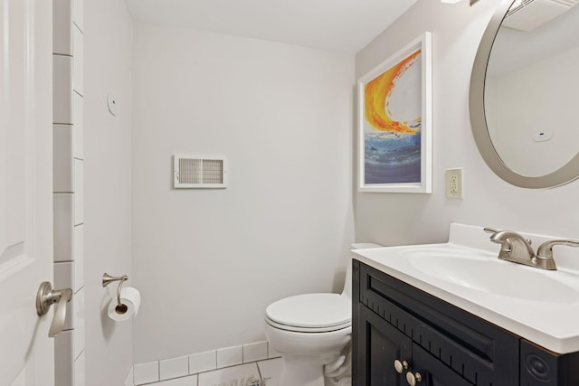 176 Peninsula Rd, Medicine Lake, MN 55441 - bathroom featuring toilet, vanity, and tile patterned floors
