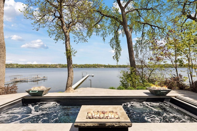 176 Peninsula Rd, Medicine Lake, MN 55441 - dock area featuring an outdoor fire pit and a water view