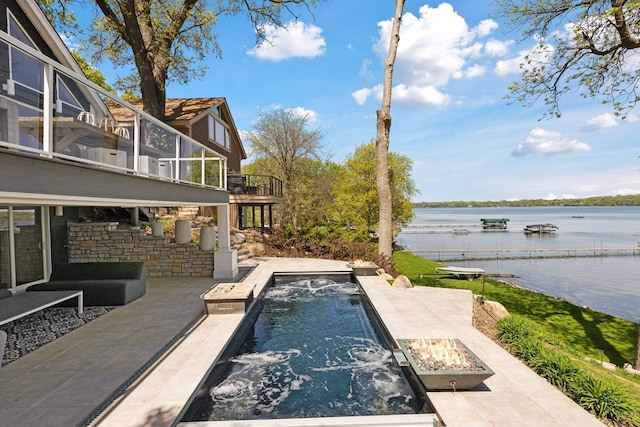 176 Peninsula Rd, Medicine Lake, MN 55441 - outdoor pool featuring a fire pit, a water view, and a patio