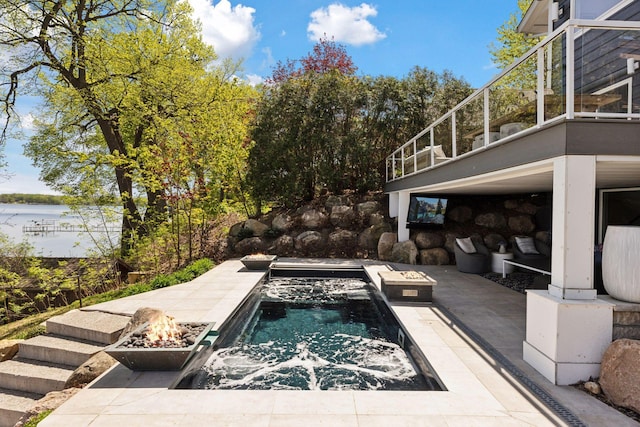 176 Peninsula Rd, Medicine Lake, MN 55441 - view of pool featuring a fire pit, stairway, a water view, and a patio area