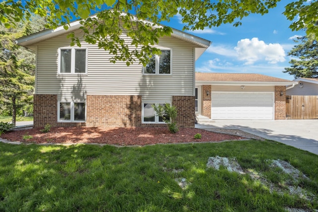 1112 Gabbert Cir, Eagan, MN 55123 - view of front facade with brick siding, an attached garage, and concrete driveway