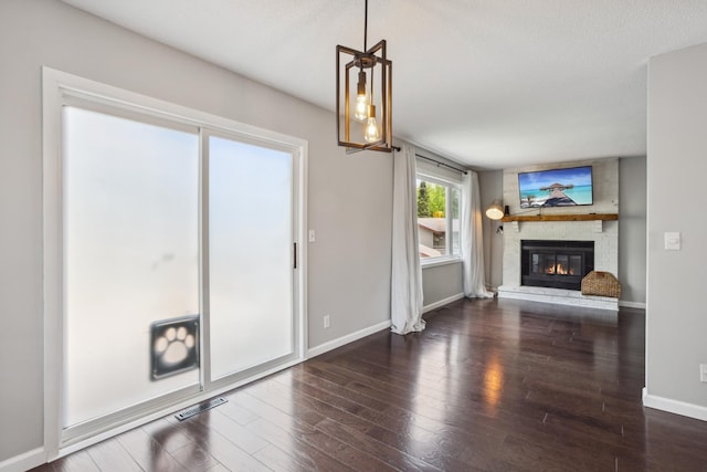 1112 Gabbert Cir, Eagan, MN 55123 - unfurnished living room featuring baseboards, a fireplace, and wood finished floors