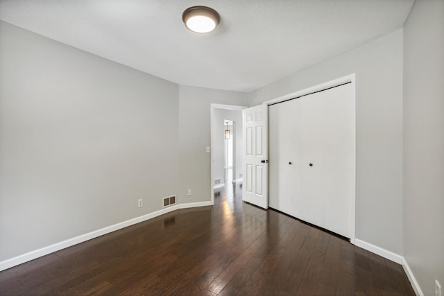 1112 Gabbert Cir, Eagan, MN 55123 - unfurnished bedroom with wood-type flooring, baseboards, and a closet