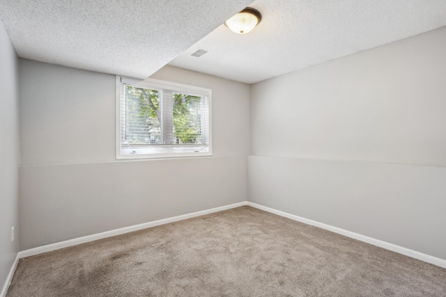 1112 Gabbert Cir, Eagan, MN 55123 - spare room featuring carpet flooring, a textured ceiling, and baseboards