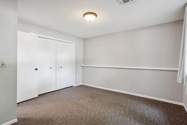 1112 Gabbert Cir, Eagan, MN 55123 - unfurnished bedroom with carpet flooring, a closet, baseboards, and a textured ceiling