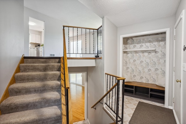 1112 Gabbert Cir, Eagan, MN 55123 - stairs featuring a textured ceiling