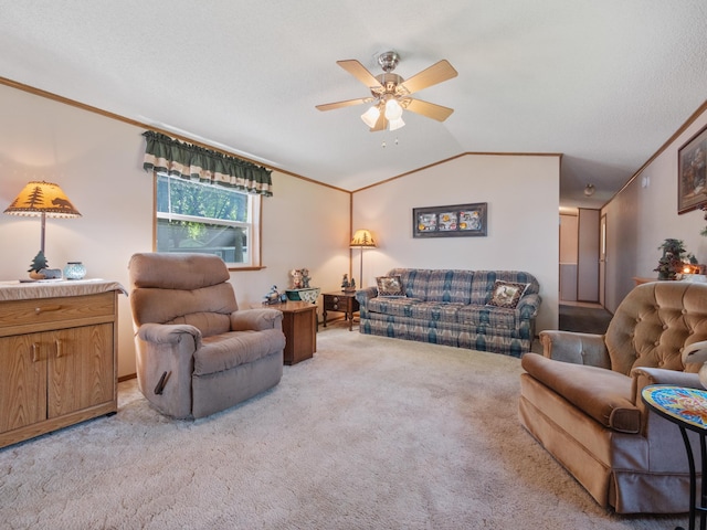 living area featuring light colored carpet, ornamental molding, lofted ceiling, and a ceiling fan