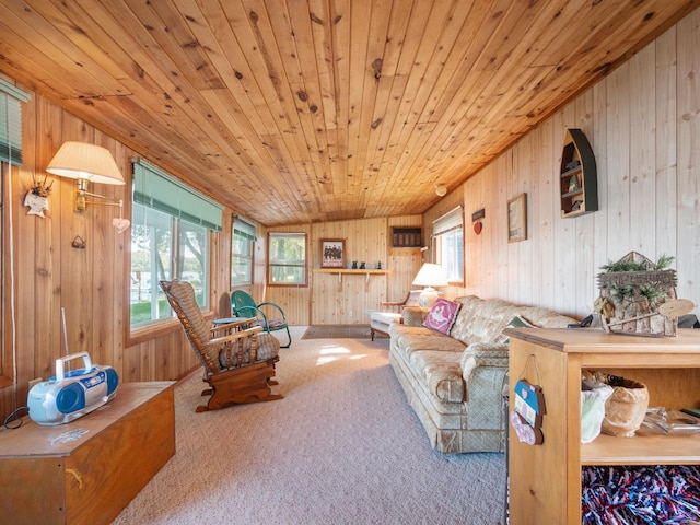 living room with wooden ceiling, wood walls, carpet floors, and a healthy amount of sunlight
