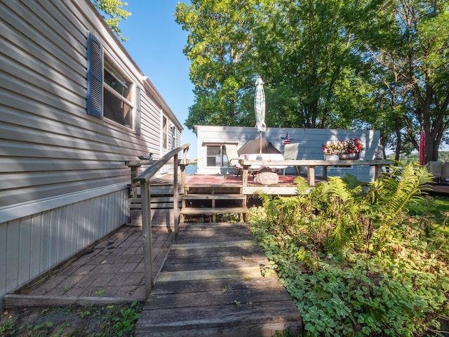 wooden deck with outdoor dining space