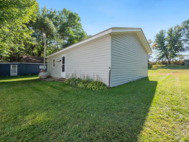 view of property exterior with a yard