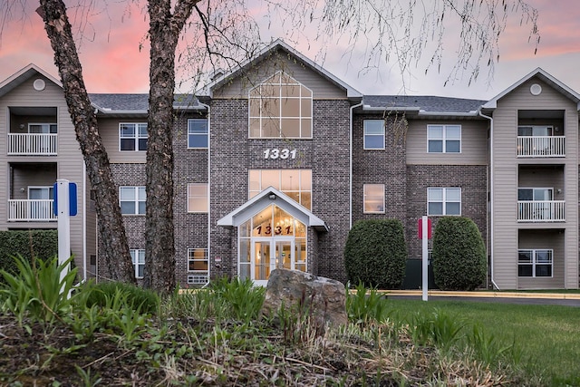 multi unit property featuring brick siding