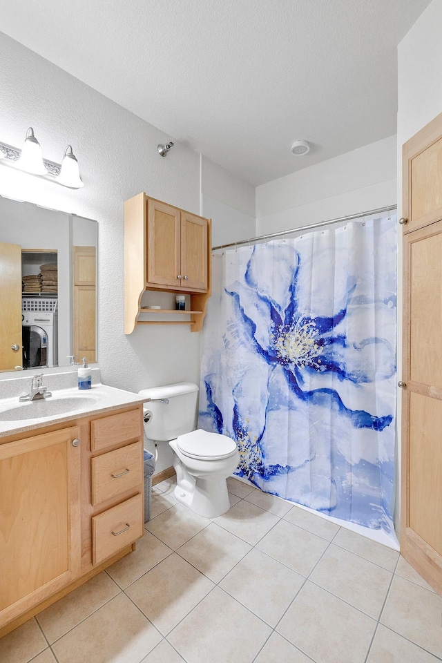 full bathroom with tile patterned floors, vanity, toilet, a textured ceiling, and a shower with shower curtain