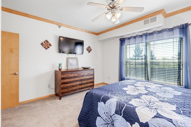 bedroom with crown molding, carpet flooring, baseboards, and ceiling fan