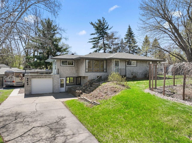 ranch-style home with a front lawn and concrete driveway