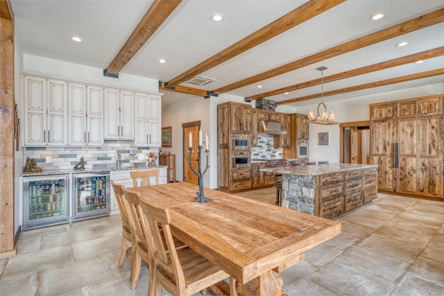 dining space with a chandelier, recessed lighting, visible vents, and beam ceiling