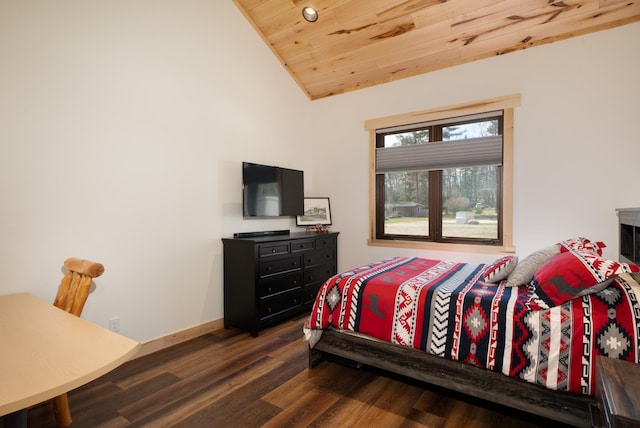 bedroom with baseboards, vaulted ceiling, wood ceiling, and wood finished floors