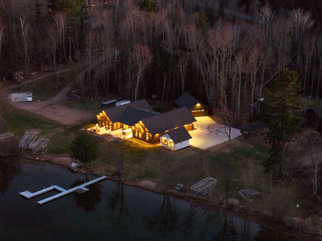 bird's eye view with a water view and a view of trees