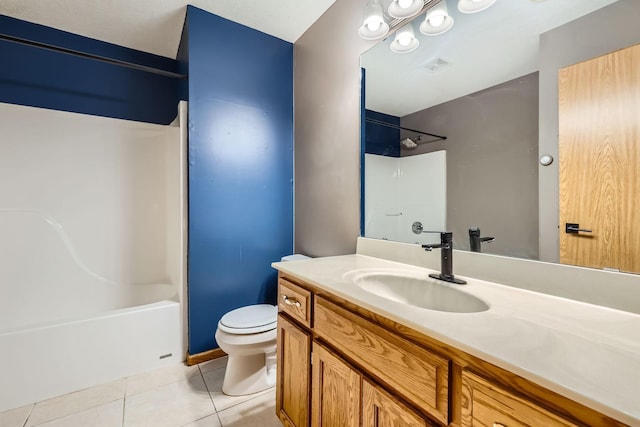 full bath with vanity, tub / shower combination, tile patterned floors, and toilet
