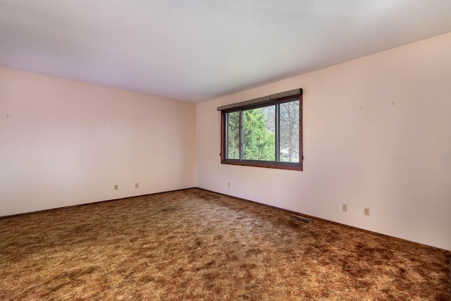1540 Peggy Ln, North Mankato, MN 56003 - empty room featuring visible vents, carpet, and baseboards