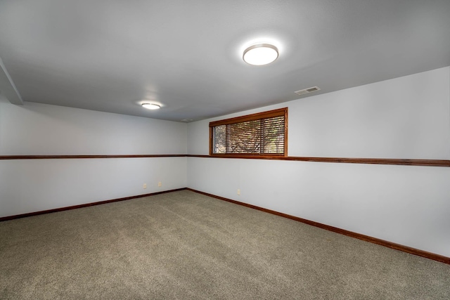 1540 Peggy Ln, North Mankato, MN 56003 - spare room featuring visible vents, carpet flooring, and baseboards