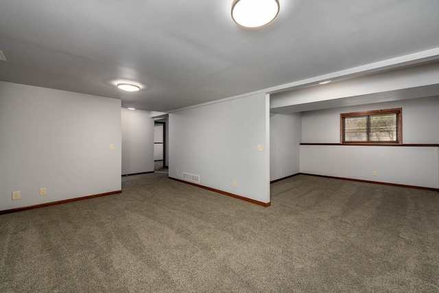 1540 Peggy Ln, North Mankato, MN 56003 - below grade area with baseboards, visible vents, and carpet flooring