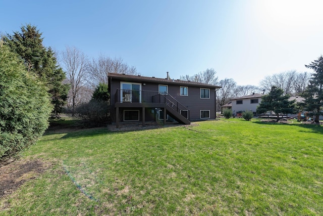 1540 Peggy Ln, North Mankato, MN 56003 - back of property with a deck, stairway, and a lawn