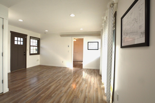 foyer entrance with recessed lighting, baseboards, and wood finished floors