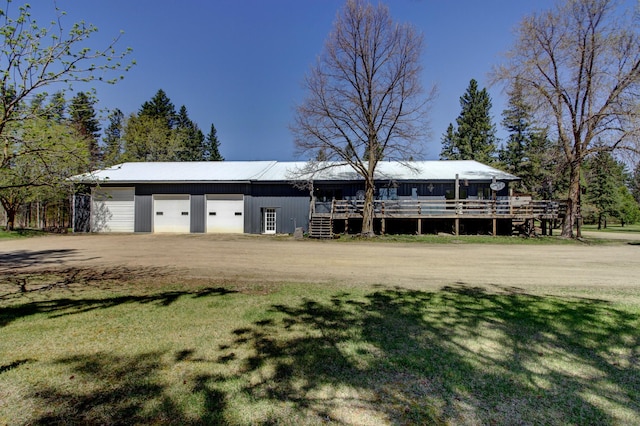 32290 US-71, Menahga, MN 56464 - view of front facade featuring a detached garage, a deck, and a front yard