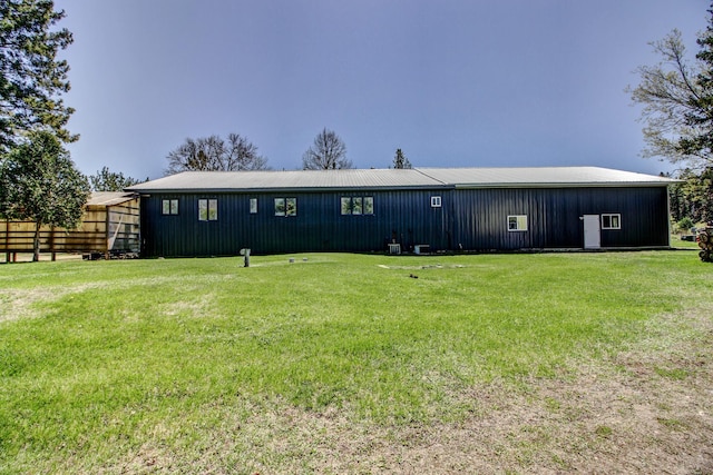 32290 US-71, Menahga, MN 56464 - view of front of home featuring a pole building, a front yard, an outdoor structure, and metal roof