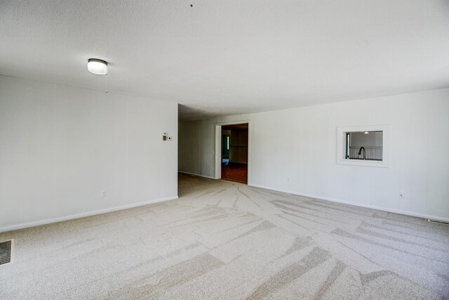 32290 US-71, Menahga, MN 56464 - carpeted spare room with baseboards and a textured ceiling