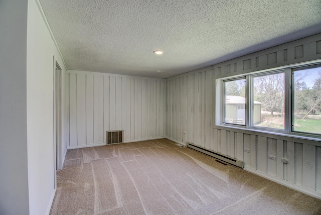 32290 US-71, Menahga, MN 56464 - carpeted empty room featuring a baseboard radiator and a textured ceiling