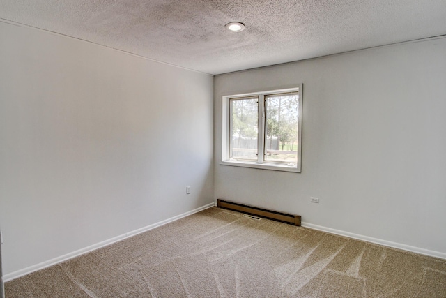 32290 US-71, Menahga, MN 56464 - carpeted spare room with a baseboard radiator, a textured ceiling, and baseboards