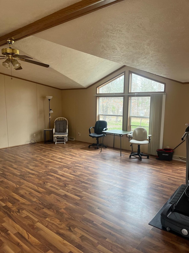 sitting room featuring wood finished floors, a ceiling fan, a textured ceiling, and lofted ceiling