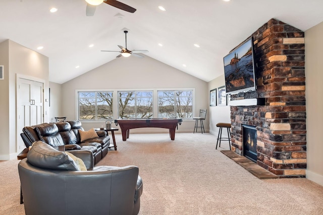 living room with ceiling fan, carpet flooring, and a wealth of natural light
