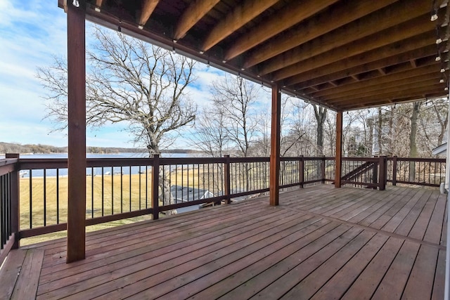 wooden deck featuring a water view