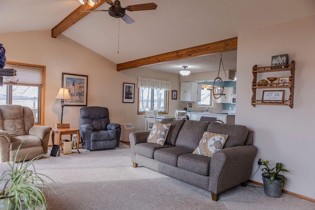 19447 County Road 1, Morris, MN 56267 - living room with light carpet, baseboards, ceiling fan, and vaulted ceiling with beams