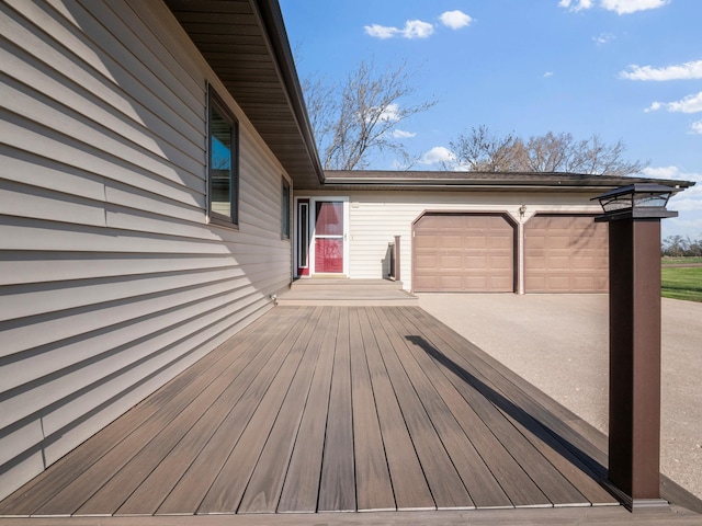 19447 County Road 1, Morris, MN 56267 - wooden deck featuring an attached garage and driveway
