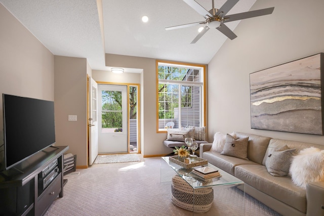 living area featuring baseboards, light carpet, a ceiling fan, recessed lighting, and high vaulted ceiling