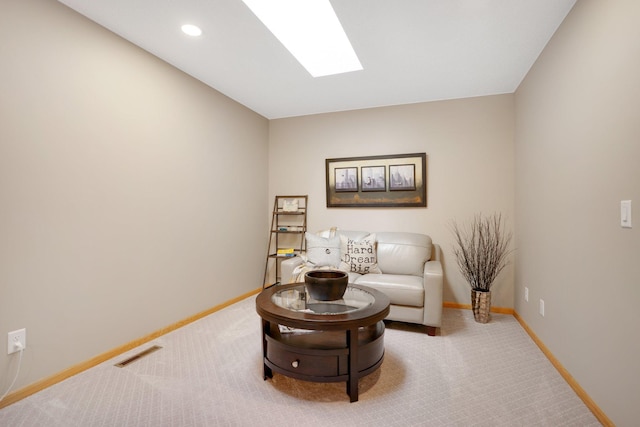 sitting room with carpet floors and baseboards